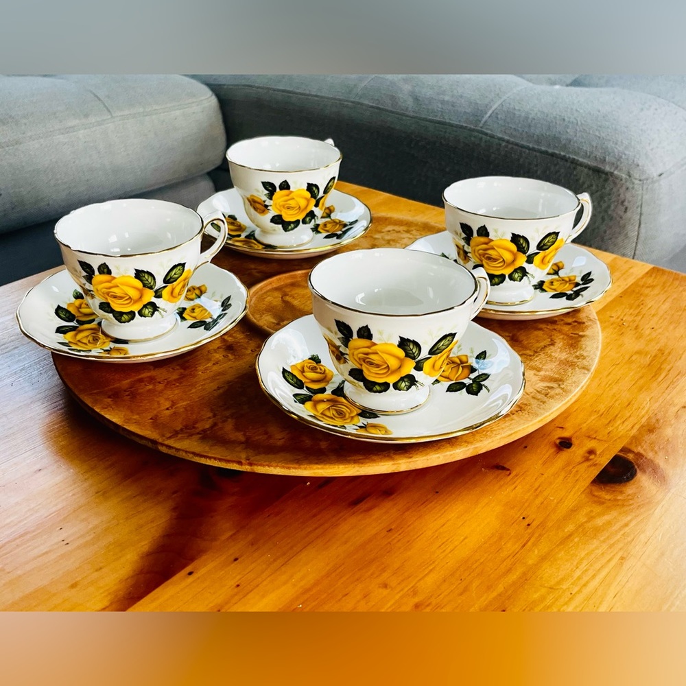 Set of 4 beautiful yellow flower teacups and saucers. Excellent condition